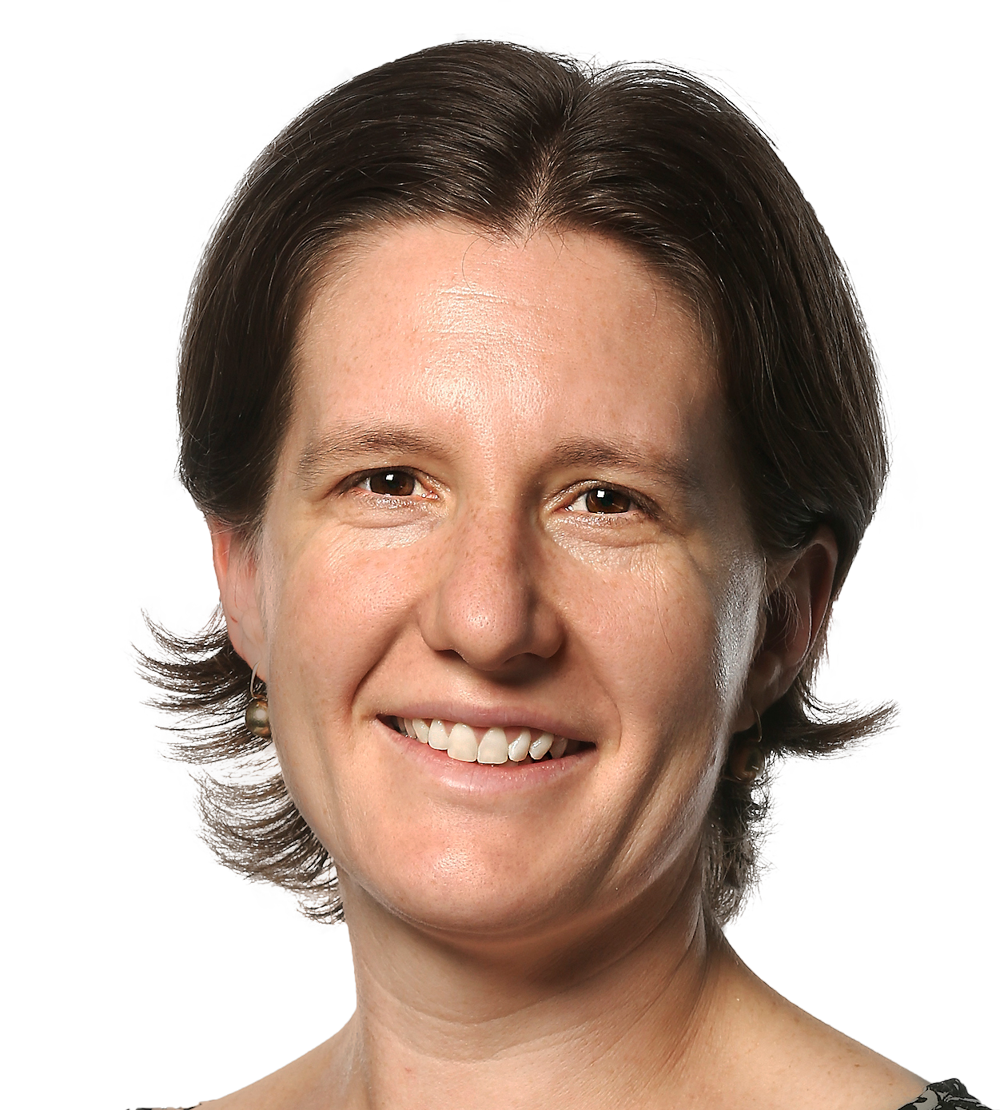 A happy woman smiles into the camera. She is Caucasian, with chin-length brown hair and brown eyes. She is wearing minimal makeup, and her smile is big. She is a Monash IVF doctor.